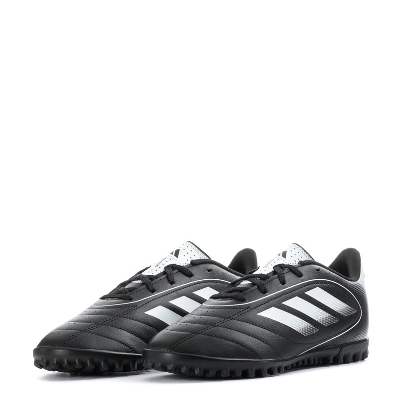 Youth black-and-white turf soccer cleat front view with lace-up and molded studs