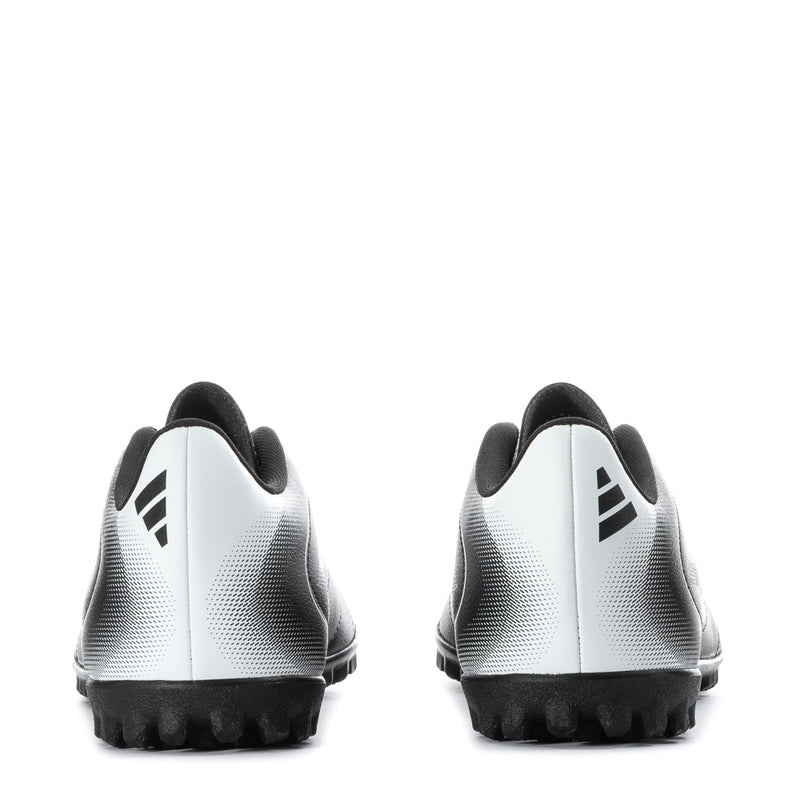 Youth black-and-white turf soccer cleat back view with white heel panels