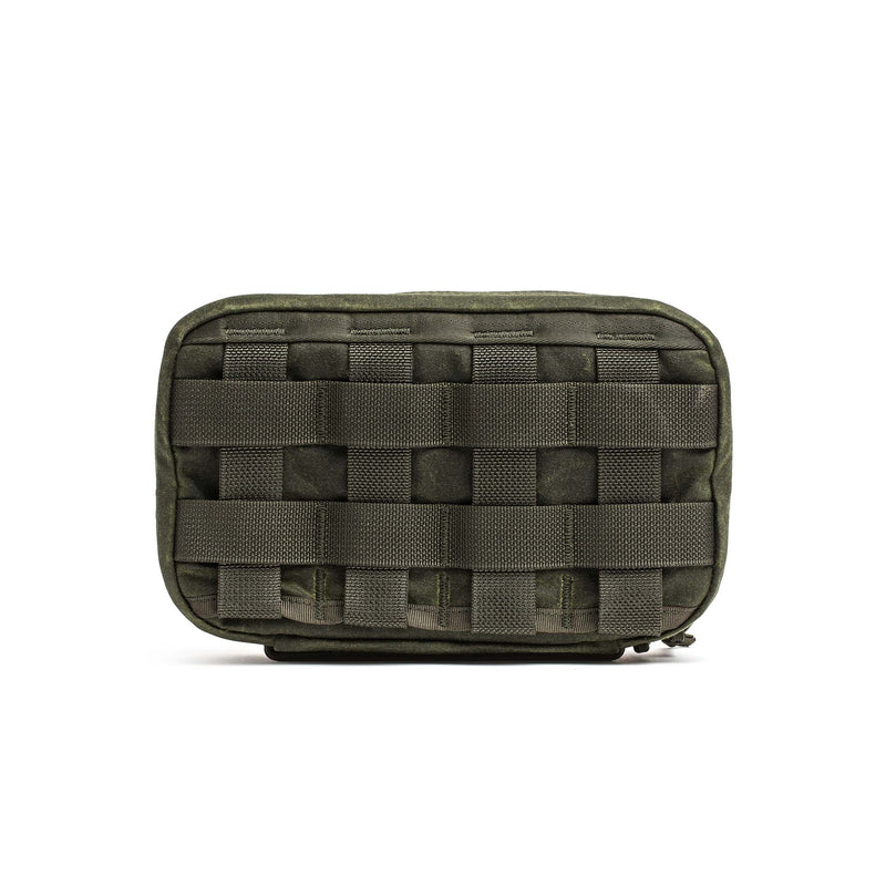 The GR1 Field Pocket - Waxed Canvas is an olive green tactical pouch with front MOLLE webbing, inspired by durable waxed canvas field pockets and shown against a white background.