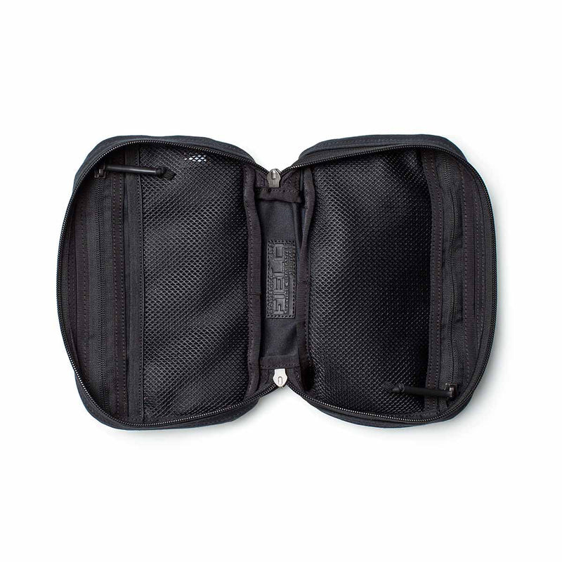 Open black zippered travel pouch with mesh pockets on both sides, empty and laid flat on a white background—ideal for organizing essentials or pairing with your GR1 Field Pocket - Waxed Canvas.