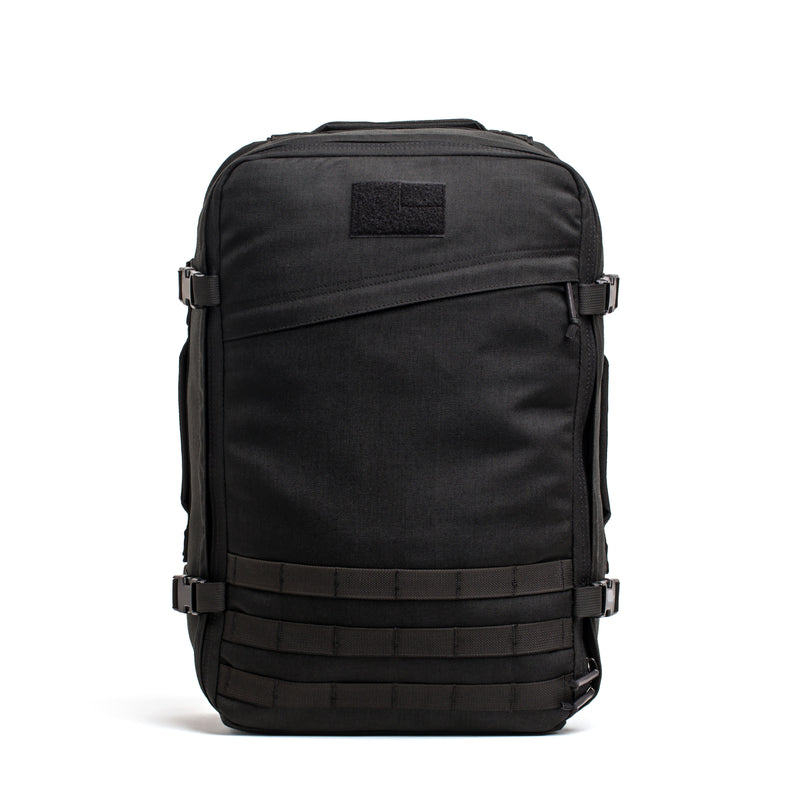 The GR3 is a black 45L backpack featuring buckles, straps, and front MOLLE webbing. Water resistant and built for durability, this carry-on rucksack stands upright and suits any adventure.