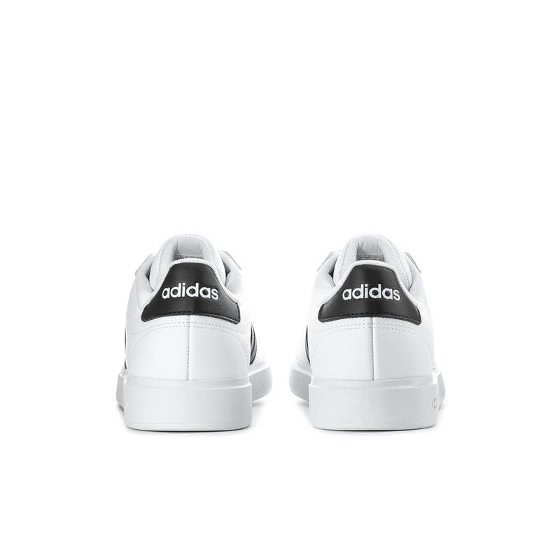 Men's white low-top sneakers, rear view with adidas heel tab
