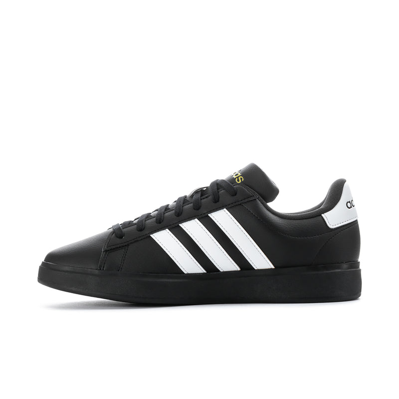 Men's black low-top sneakers with white triple stripes and padded collar
