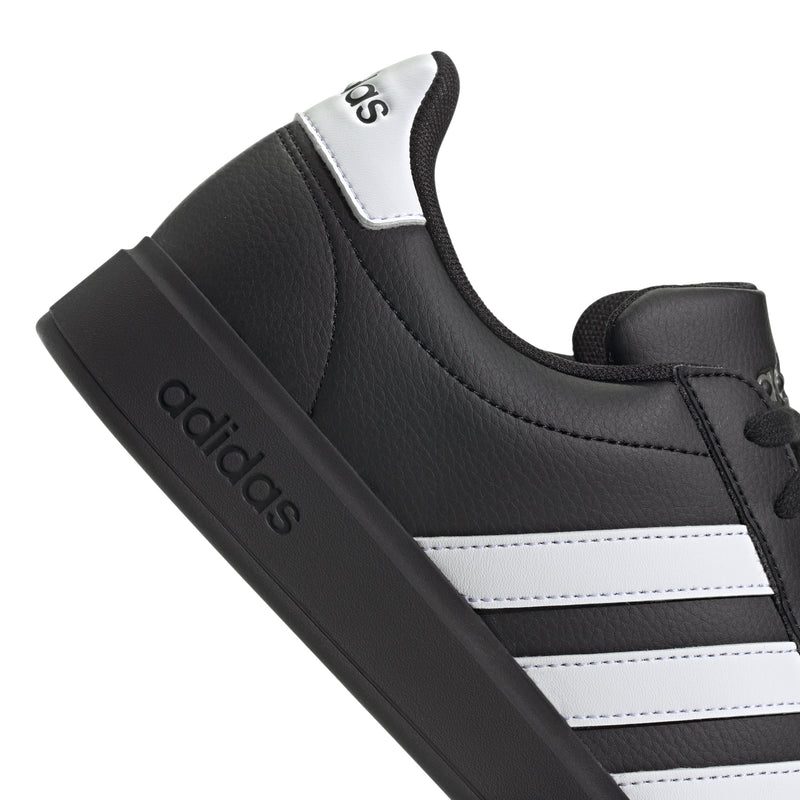 Black upper with white side stripes and adidas logo on the heel