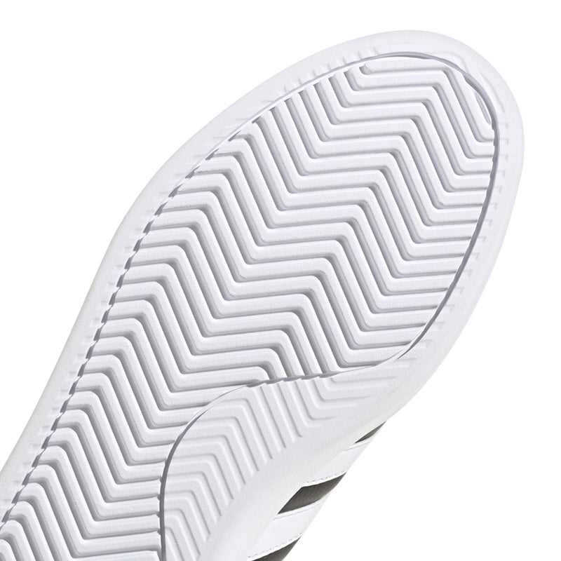 Close-up of white adidas outsole tread with zigzag grooves