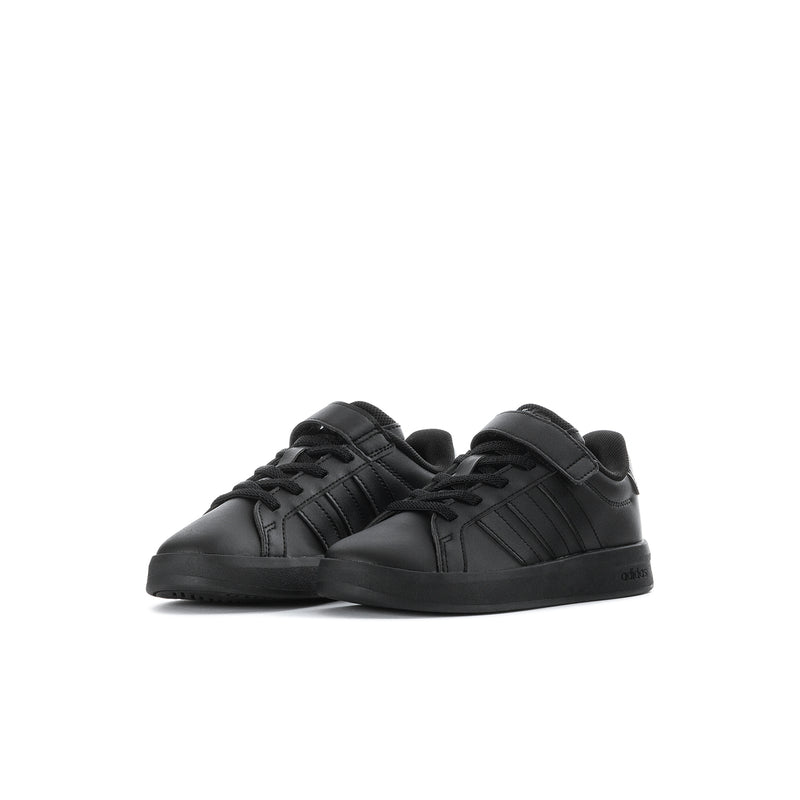 Kids black sneakers, lace-up with hook-and-loop strap, low-profile sole.