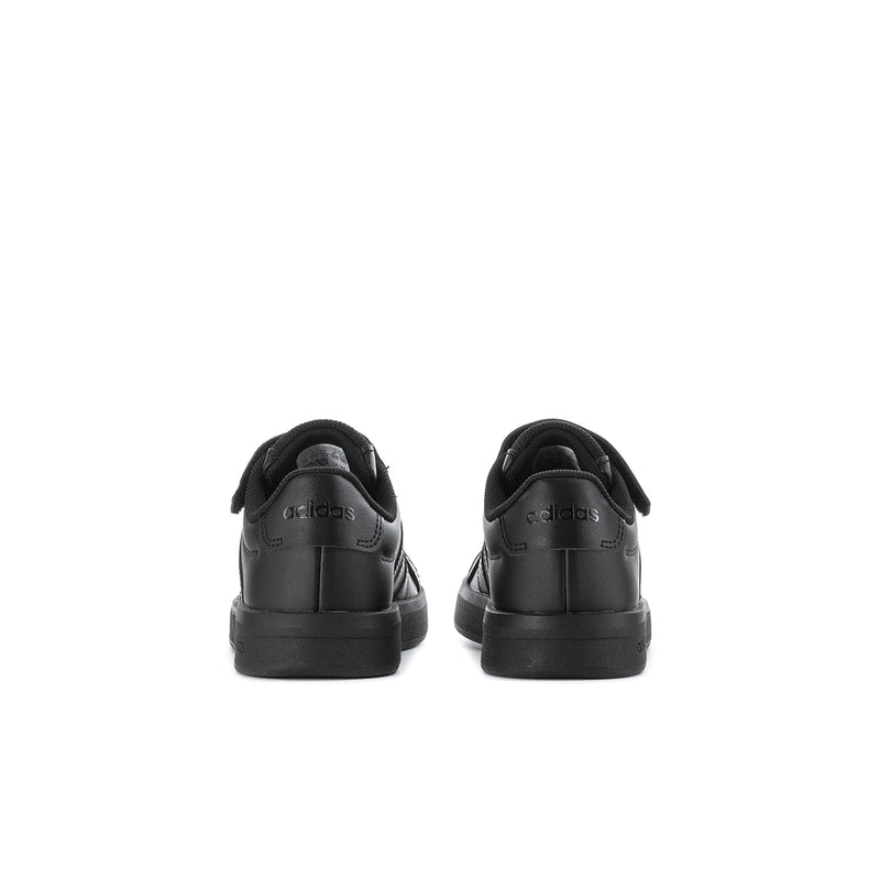 Kids black sneakers with padded collar and cushioned heel.
