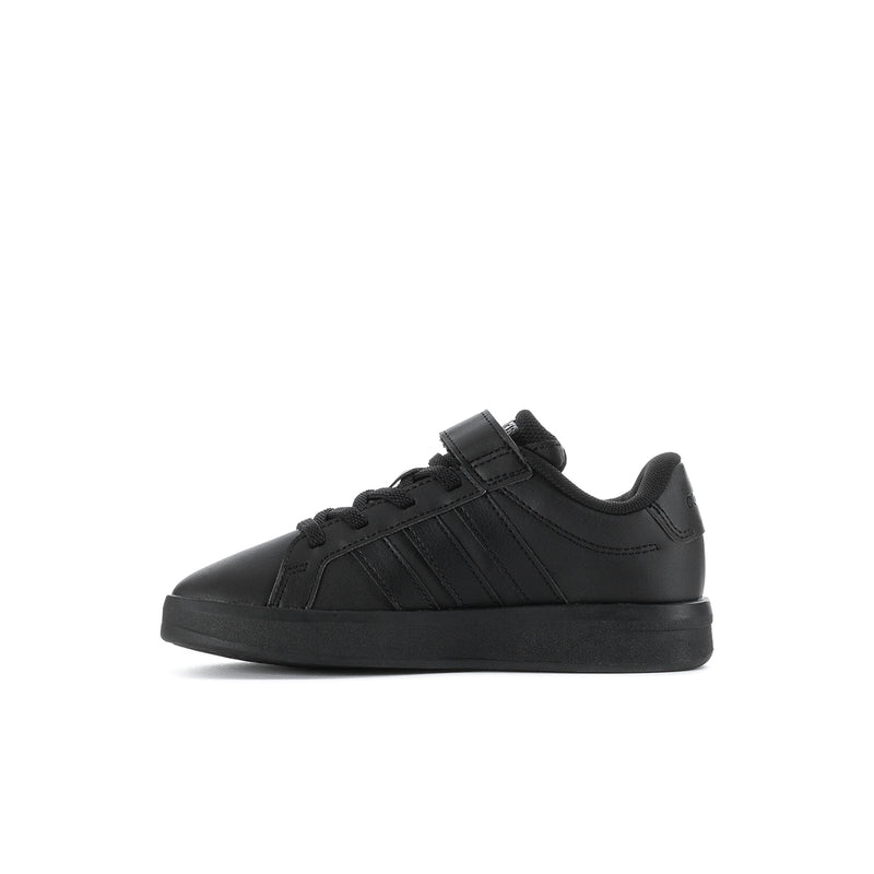 Kids black low-top sneakers with three-stripe detail and hook-and-loop strap.