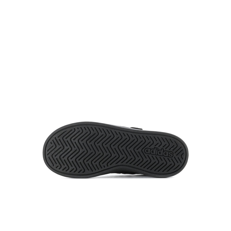 Kids black rubber outsole with herringbone tread and adidas logo.