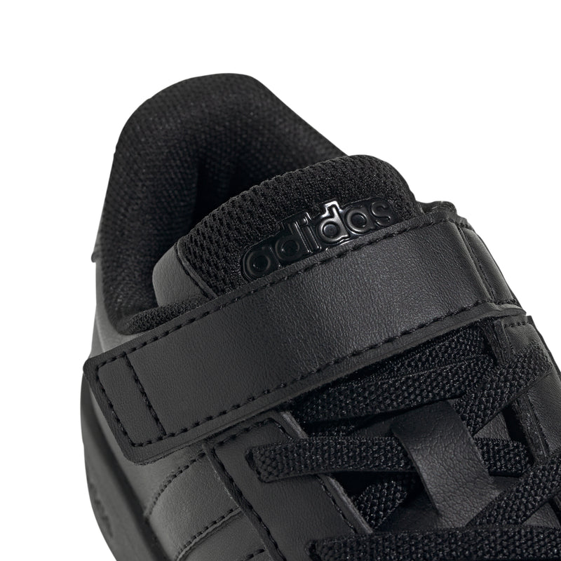 Kids black hook-and-loop strap detail with adidas lettering.