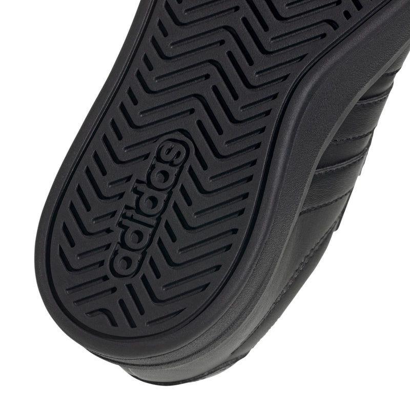 Kids black outsole tread pattern with adidas mark.