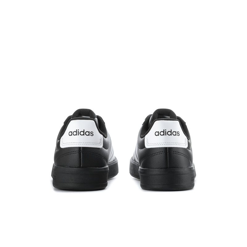 Black adidas sneakers with white heel tab and cushioned back collar