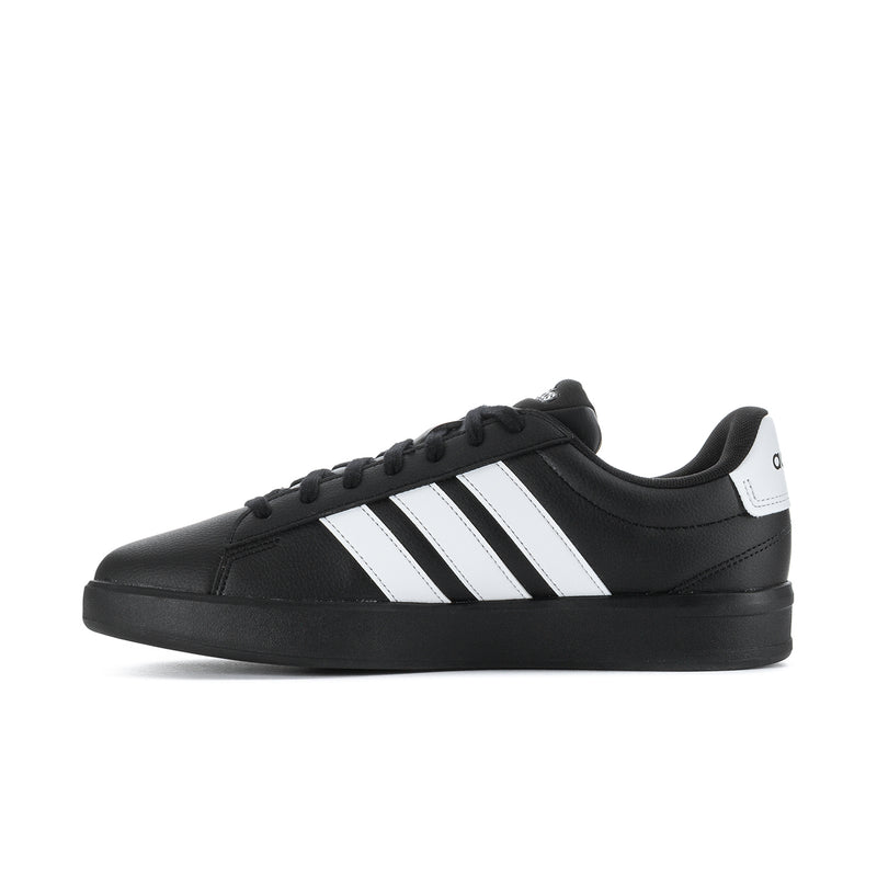 Black adidas low-top sneakers with white 3-Stripes and lace-up closure