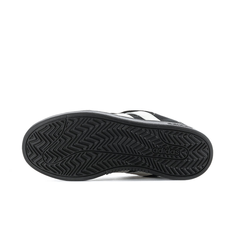 Black rubber outsole with herringbone tread and adidas logo