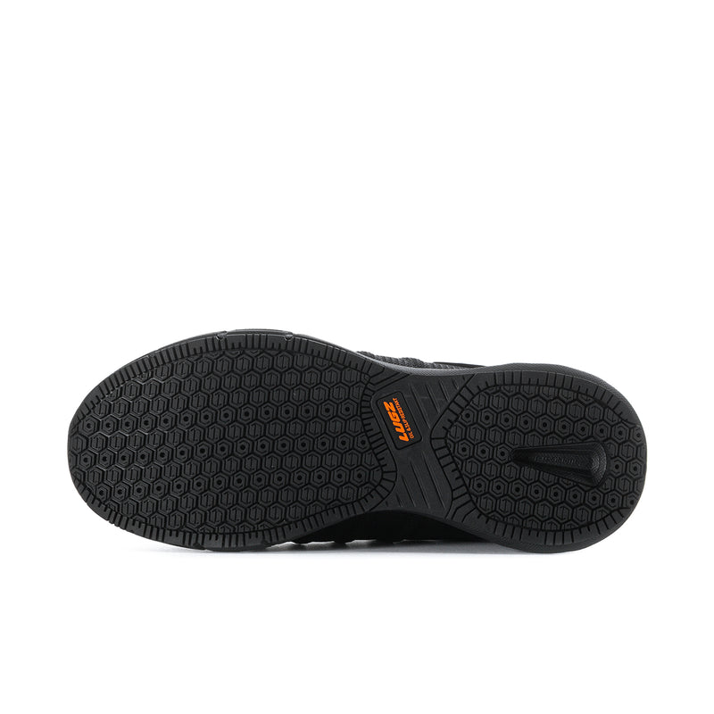 Black men's athletic shoe outsole, hex grip tread with orange brand mark