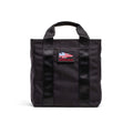 GORUCK black grocery tote bag with American flag patch and sturdy handles on white background