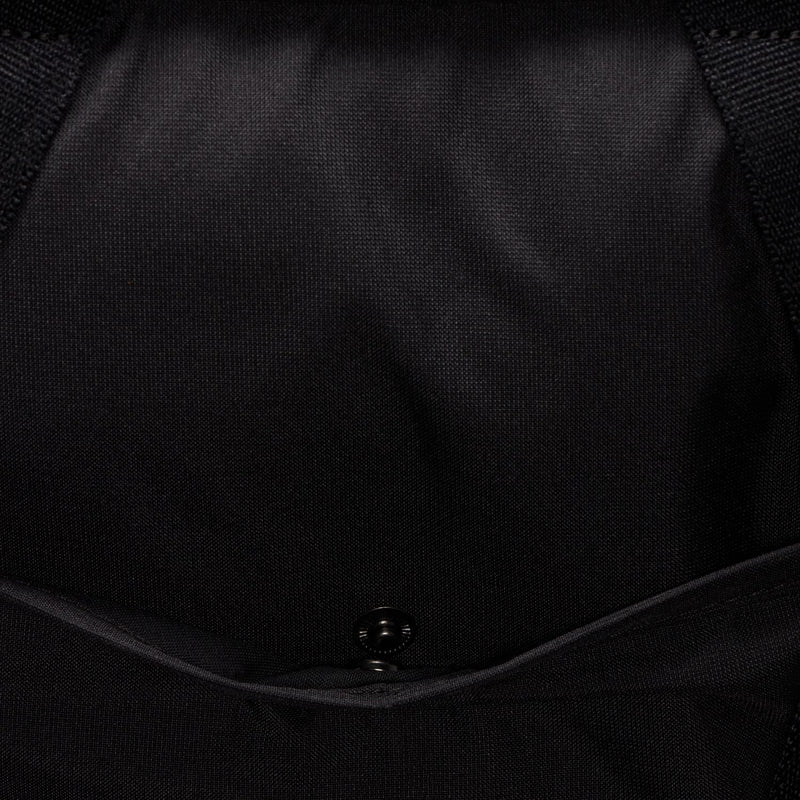 Black gym tote bag close-up of interior seam and snap button