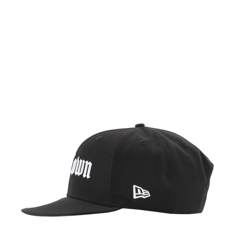 Black baseball cap with white H-Town print and New Era flag logo