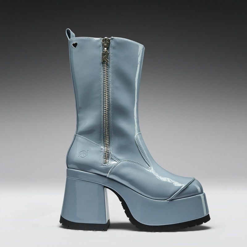 Blue platform boot with a zipper on a gray background