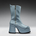 Blue platform boot with a zipper on a gray background