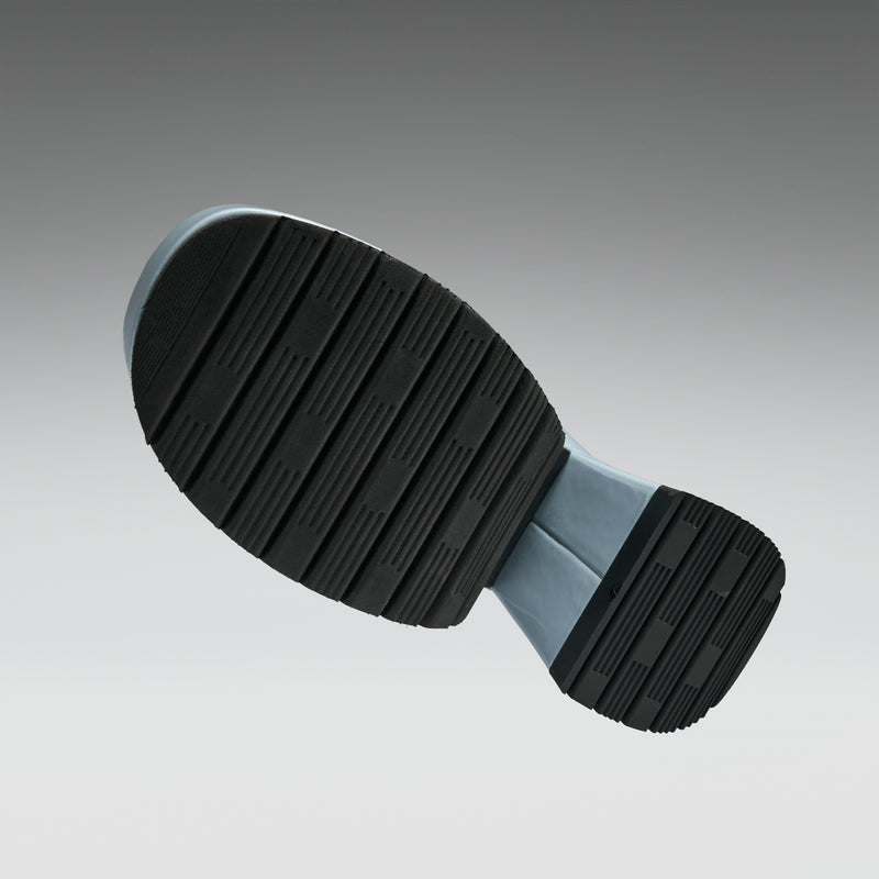 Black rubber sole on a gray background