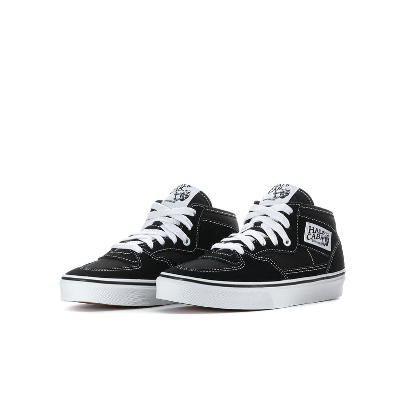 Youth black and white high-top sneakers, pair view, white laces and logo tongue patch