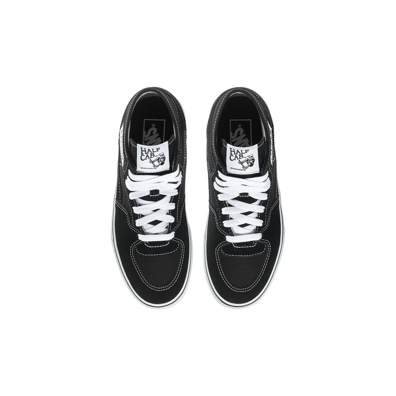 Youth black high-top sneakers with white laces, top view of two shoes