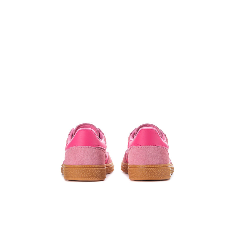 Kids pink sneakers viewed from heel, showing gum sole and back pull tab