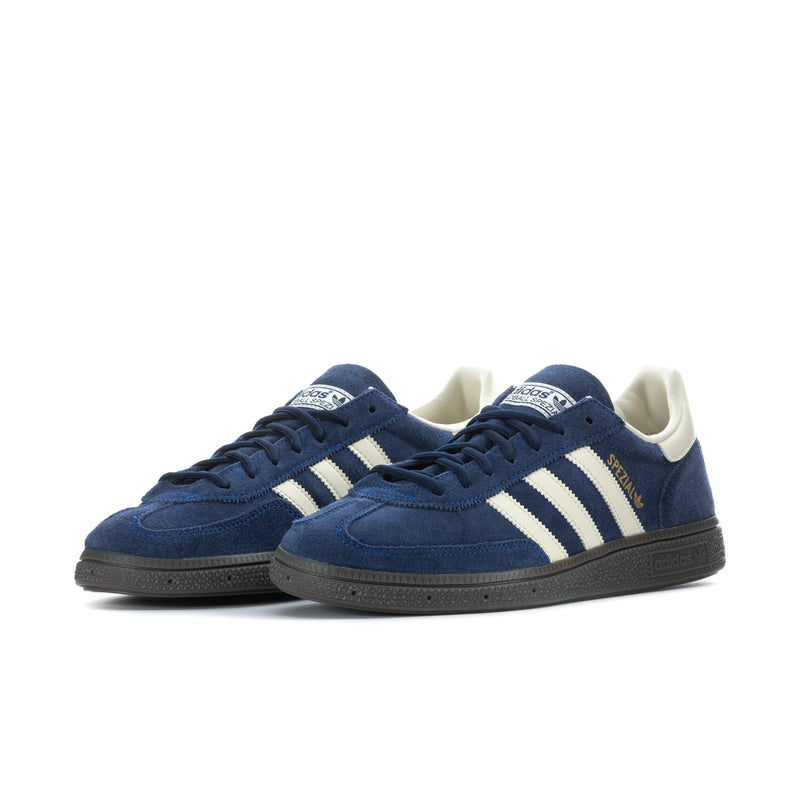 Pair of men's blue lace-up sneakers with cream adidas-style stripes