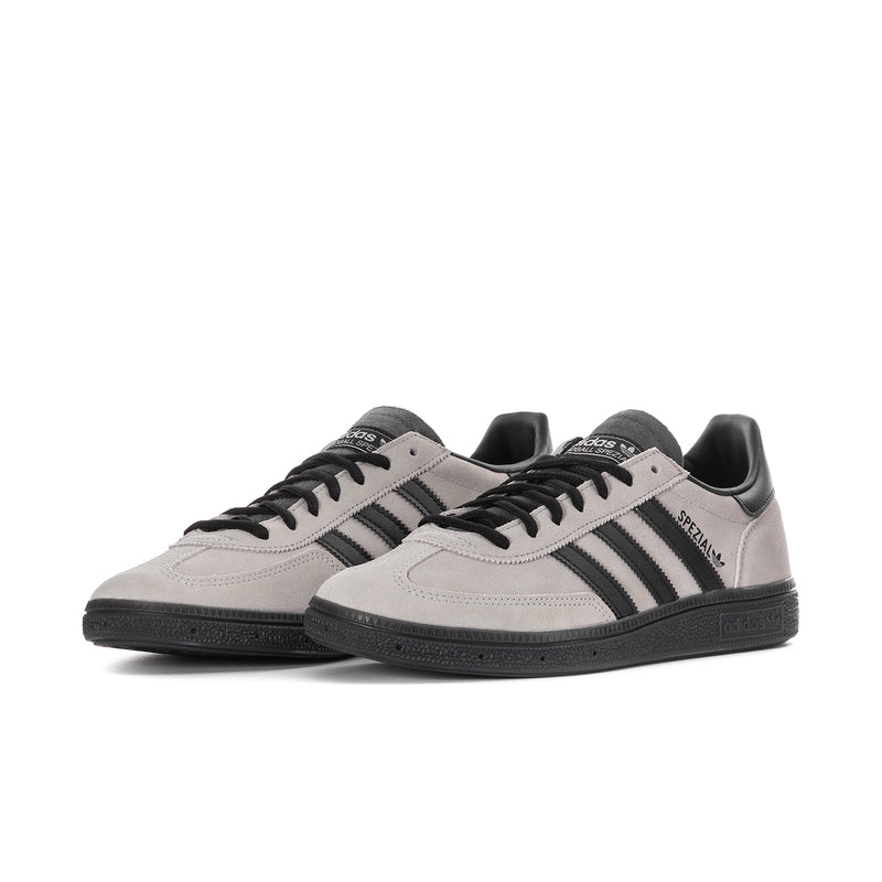 Light gray men's sneakers with black stripes and lace-up front, low profile