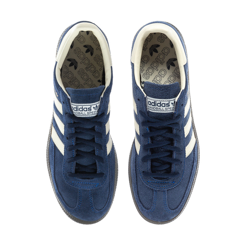 Front view of men's blue sneakers with cream stripes and dark laces