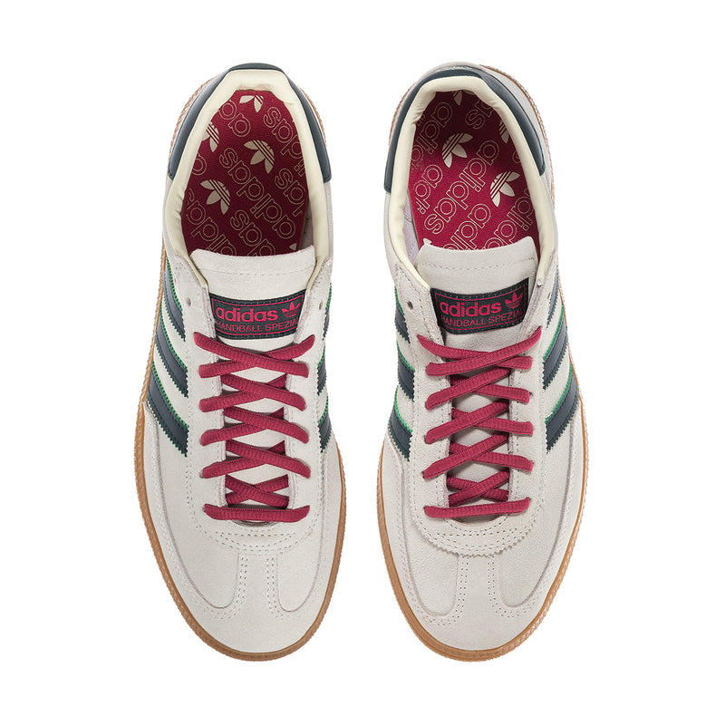 Men's Handball Spezial sneakers with pink lace eyelets, ivory leather, teal heel stripes.