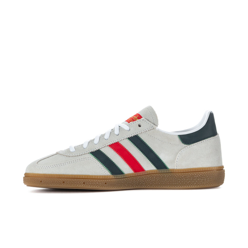 Men's low-top suede sneaker in white with red center stripe, green stripe, gum sole