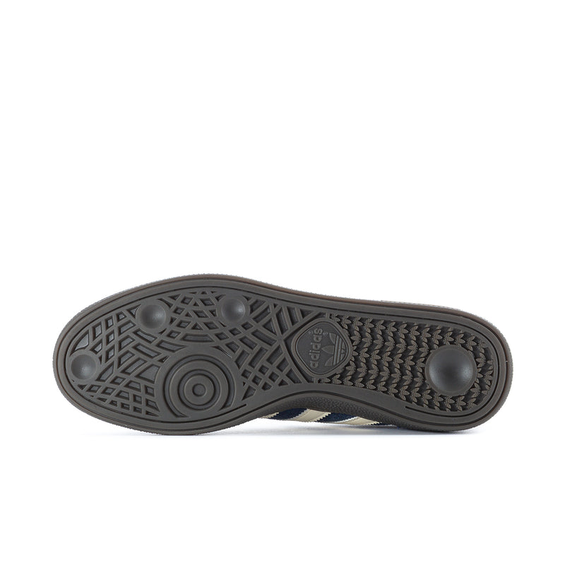 Blue sneaker outsole with textured tread and adidas logo