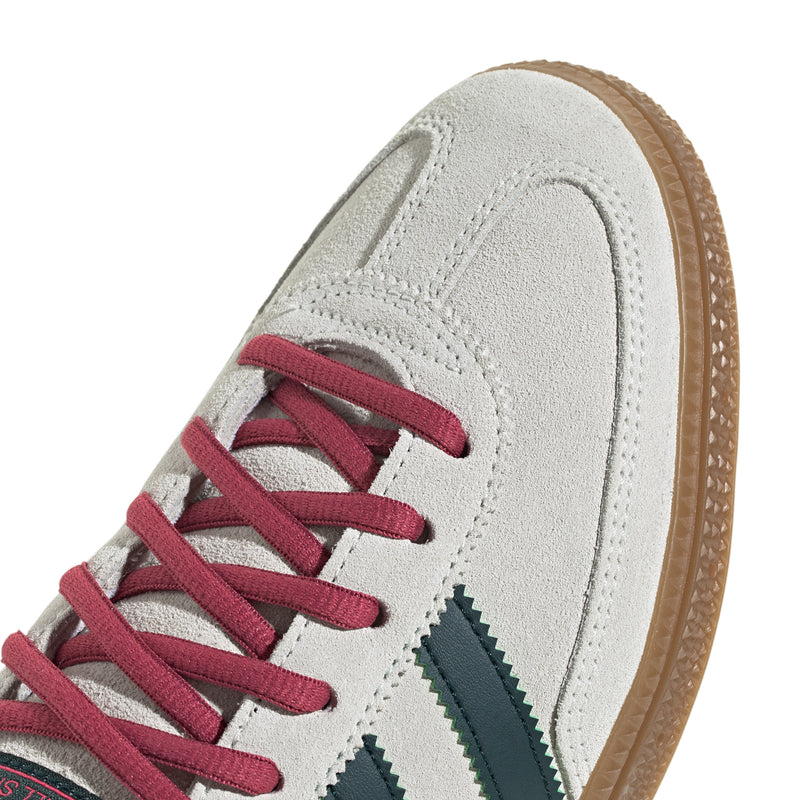 Men's Handball Spezial toe view: ivory suede with pink laces and visible stitching.