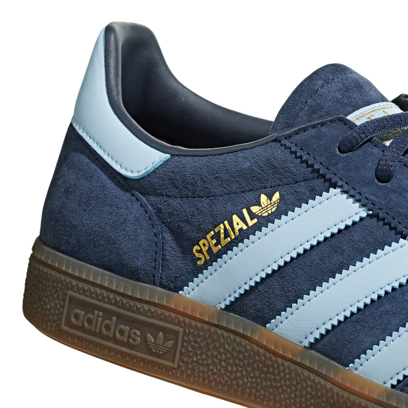 Navy suede sneakers with 'SPEZIAL' patch, light blue stripes, gum sole.