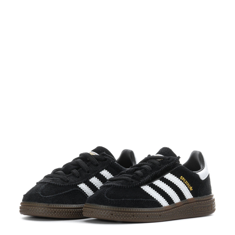 Pair of kids black low-top sneakers with white triple stripes, lace-up design, and gum soles.
