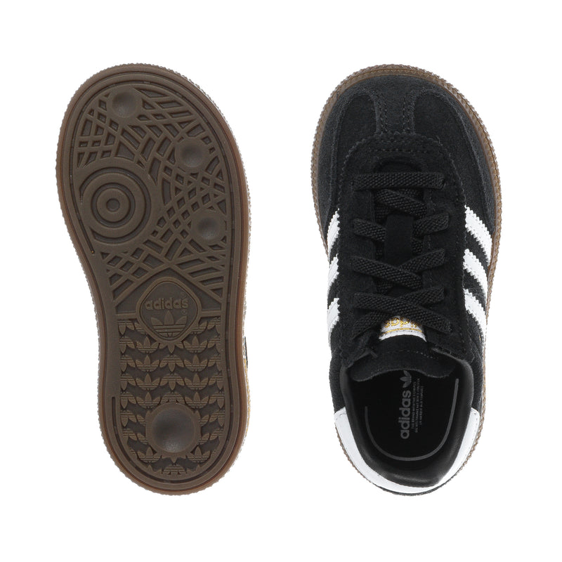 Kids black sneakers with white stripes shown from outsole and inner side; gum traction sole.