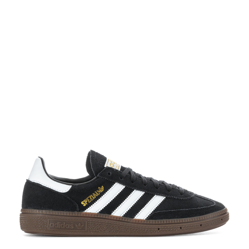 Youth black suede sneakers with white adidas stripes and gum rubber sole