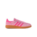 Youth pink adidas handball sneaker with three stripes and gum sole