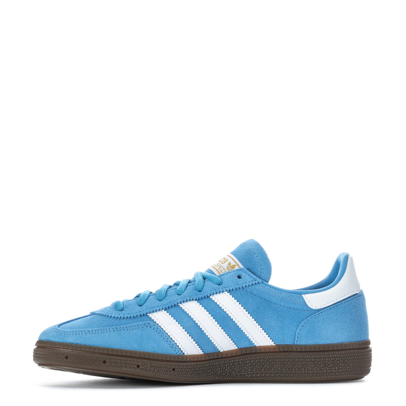 Youth light blue low-top sneakers with white adidas stripes and brown gum outsole