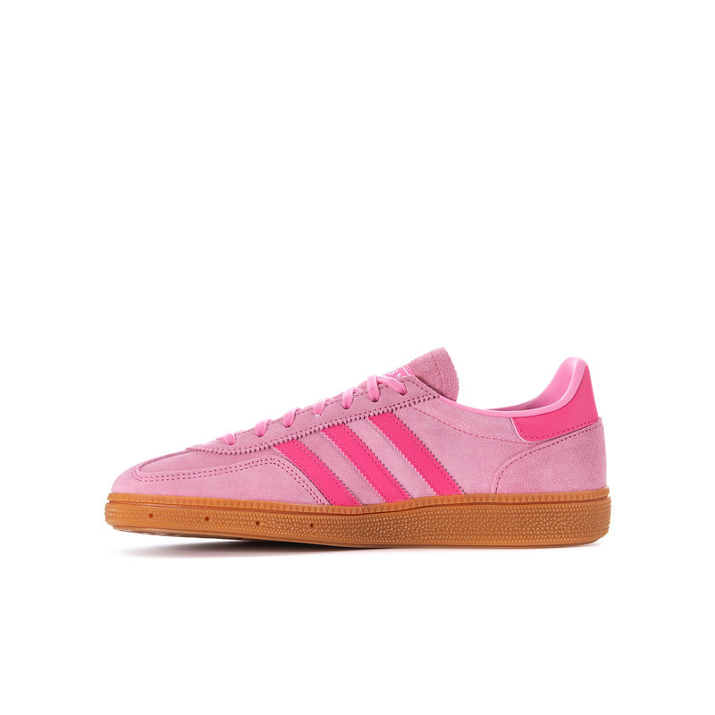Youth pink adidas low-top sneaker with lace-up front and three stripe details