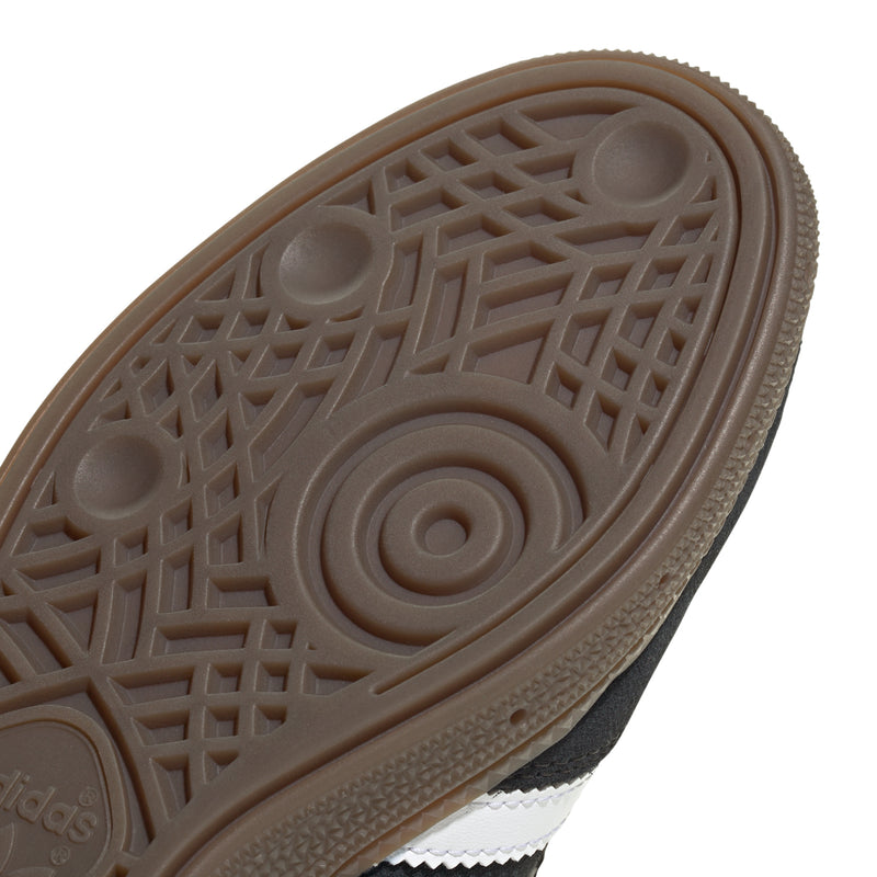 Youth adidas sneaker outsole with brown rubber tread pattern