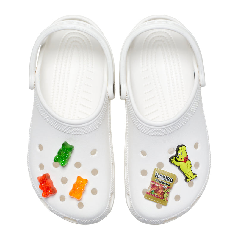 White clogs with Haribo Jibbitz gummy bear charms and Goldbears bag charm