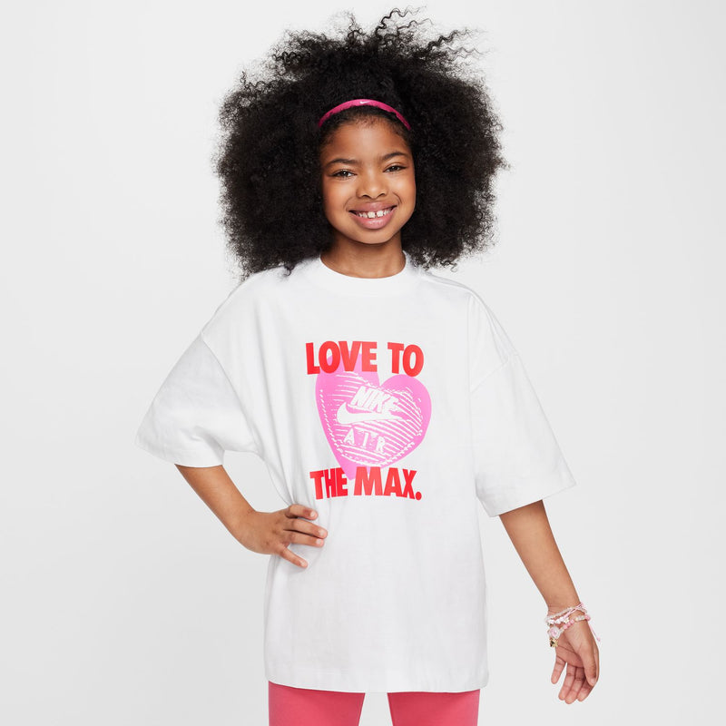 Youth white graphic heart tee worn by child, front print 'LOVE TO THE MAX.'
