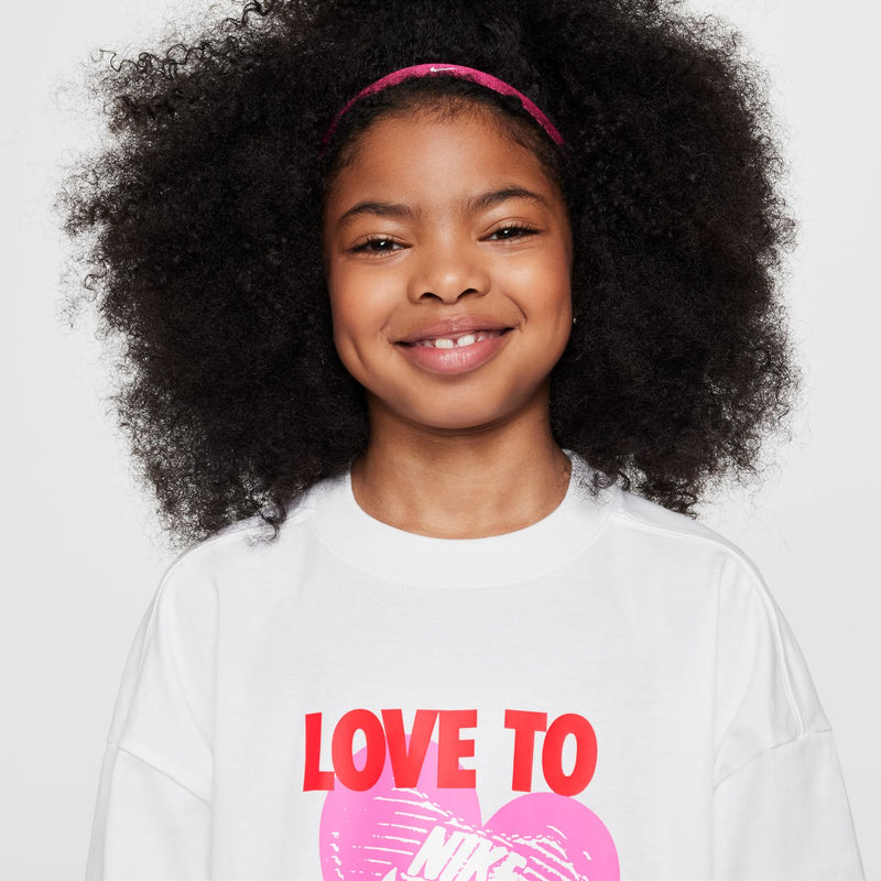 Youth white graphic heart tee close-up of chest print 'LOVE TO THE MAX.'