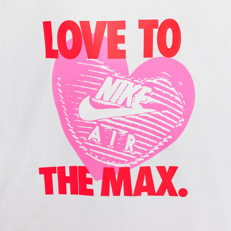 Close-up youth white tee graphic: pink heart with 'LOVE TO THE MAX.'