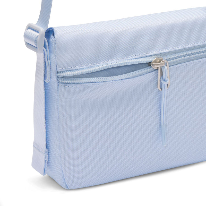 Nike heritage mag crossbody bag close-up, light blue side zipper and strap attachment