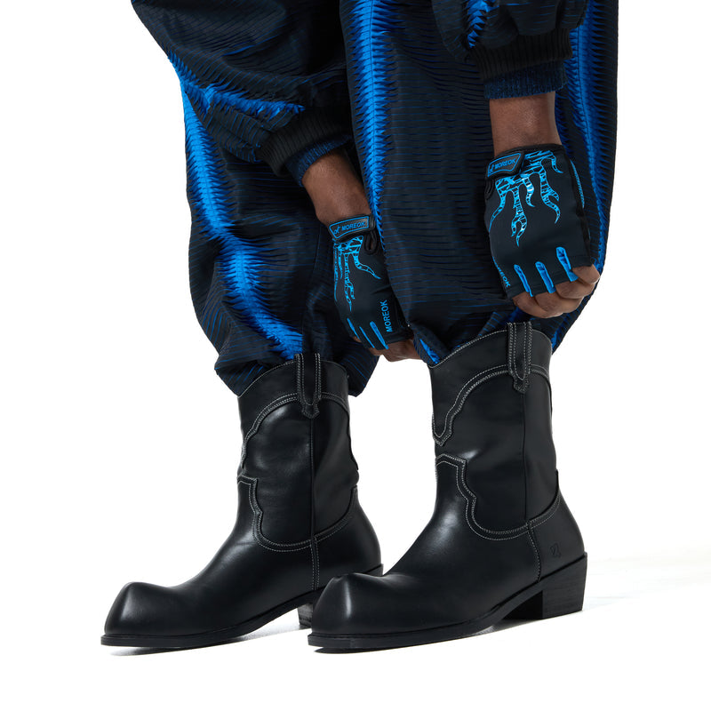 Black boots and blue gloves with intricate designs on a white background