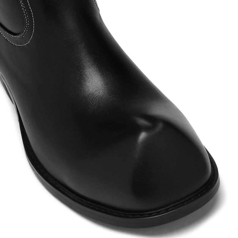 Black leather ankle boot on a white background